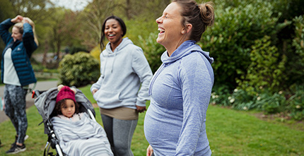 Mothers laughing in park